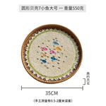 plateau rond rotin coquillages feuilles naturelles décoration boho assiette fruits pain petit déjeuner