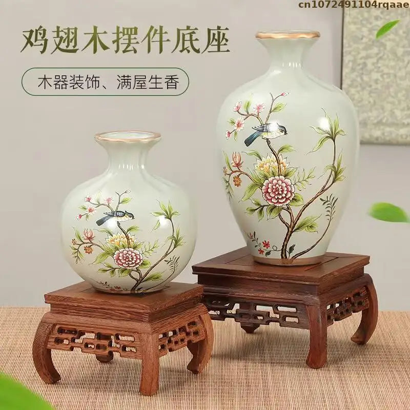 supports bois sculptés vases peints main artisanat traditionnel fleurs oiseaux motifs géométriques vert clair