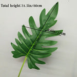 plantes artificielles vertes feuilles larges moderne decoration intérieure feuilles nervures perforations racines apparentes minimaliste