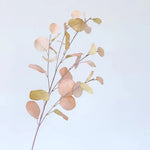 bouquet artificiel feuilles ovales rose pâle moderne vase transparent décoration intérieure minimaliste naturelle exposition