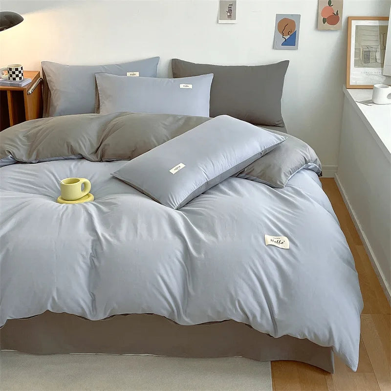 ensemble literie couverture taies oreillers gris clair gris foncé jaune tissu lisse aspect mat
