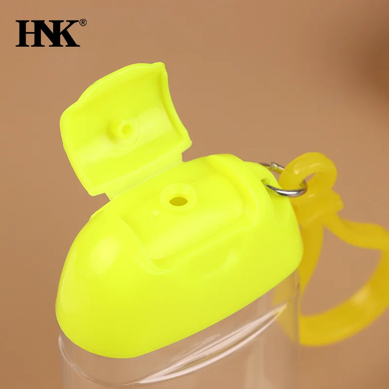 bouteilles rechargeables transparentes modernes couleurs variées anneaux boucles pratique mini désinfectant main cosmétique alcool