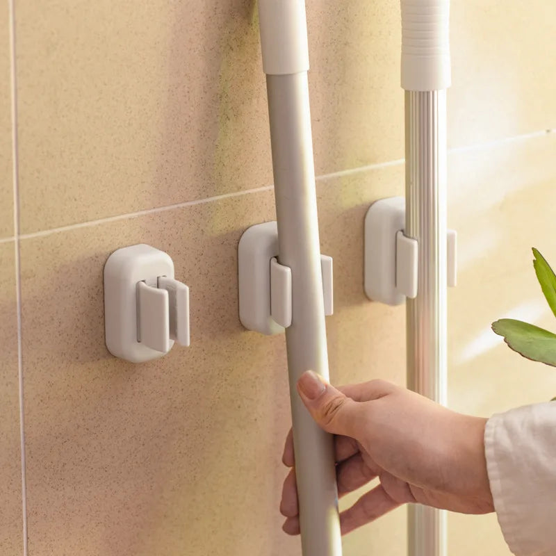 organisateur salle bain auto adhésif support brosses dents balais mural blanc minimaliste modernité rangement