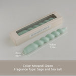 bougies parfumées vert pastel jaune rose blanches twistées moderne support nœud anniversaire décoration maison