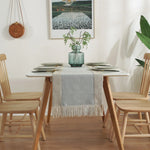 nappe tissée franges scandinave minimaliste gris beige vertebranches verte plante verte pot artwork encadré