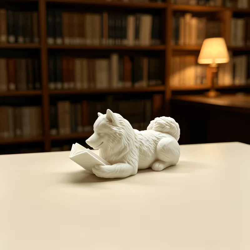 statue chien couché livre ouvert blanc noir décoration intérieur 10cm longueur 5cm hauteur festive