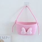 panier rangement rose blanc rayures horizontales noeud décoratif réutilisable polyestère enfantin cordelette organisation jouets