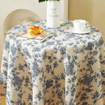 nappe ronde fleur bleue motif floral rustique franges table beige