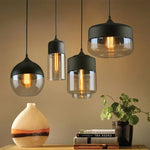 suspension lumineuse moderne pendentif verre noir transparent contemporain fixation câble luminaire salle manger chambre