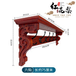porte manteau étagère murale bois marron foncé crochets décor sculpté motifs floraux classique vis