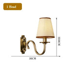 chandelier bronze classique suspension lumière abat jours tissu texturé courbes salle manger