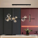 suspension lumineuse moderne noir boules transparentes scandinave chaînes suspendues interrupteur poussoir lumière salon cuisine