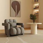 fauteuil moderne tissu texturé beige jaune marron clair coussin décoratif salon minimaliste