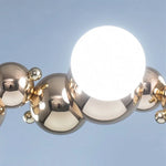 suspension lumineuse moderne doré blanc boules métalliques sphères translucides câble fixé nordique éclairage intérieur