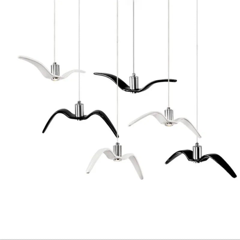 suspension lumineuse moderne oiseau stylisé noir blanc câbles opacité chambre salon