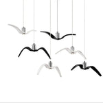 suspension lumineuse moderne oiseau stylisé noir blanc câbles opacité chambre salon