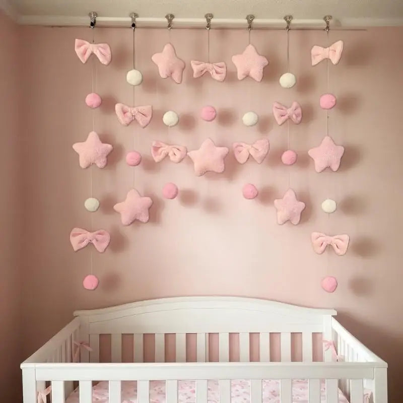 guirlande décorative étoiles nœuds boules rose clair blanc douce clips