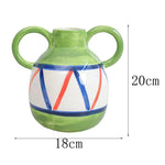 vase decoratif porcelainne stripes motif visage stylise decoration table centerpiece fleurs