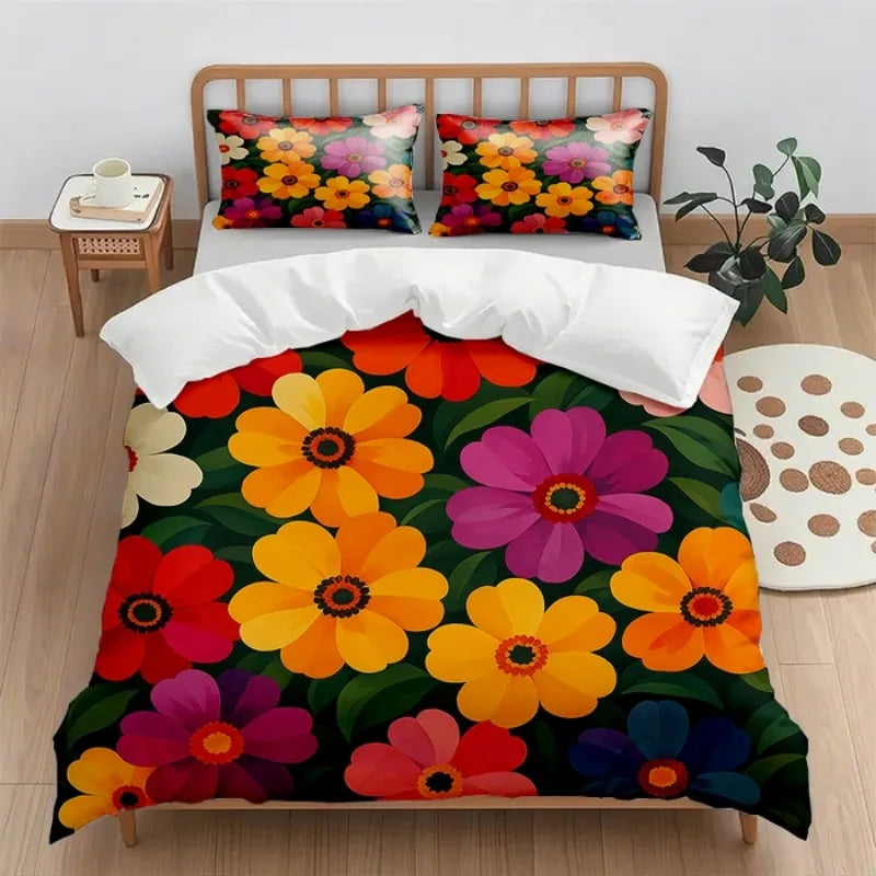 Une chambre chaleureuse et accueillante avec un édredon aux couleurs vives et éclatantes représentant des fleurs épanouies dans des tons orangés, rouges et violets, créant une ambiance apaisante et joyeuse.