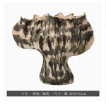 vase moderne porcelaine rose pâle ondulé décoration maison salon arrangement floral