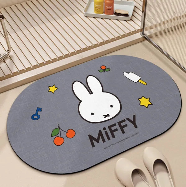 tapis bain dessin animé lapins gris jaune vert bleu rayures enfantin absorbant