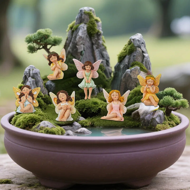 statues fées miniatures résine vert rose jaune robes colorées ailes translucides fantaisie decoration exterieure
