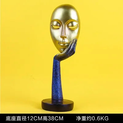 masque sculptural contemporain noir blanc doré finement sculpté base circulaire ornement salon