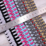 ruban tissé dentelle franges coton nylon bleu clair rose noir gris rayures horizontales artisanal