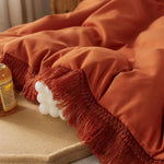 Parure de lit 3 pièces orange brûlé dans une chambre décorée style boho