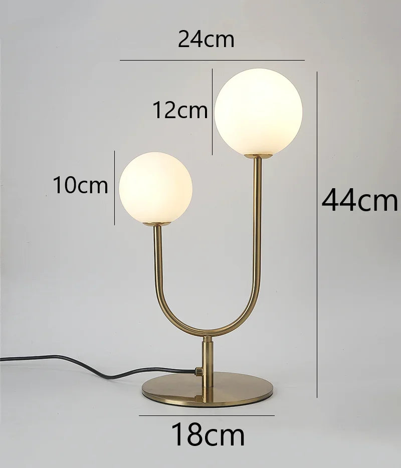 lampe table moderne or blanc sphères translucides câble noir base plate
