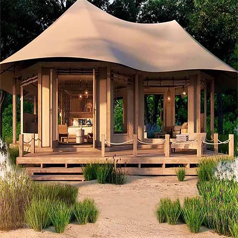 tente luxe moderne toile impermée beige blanche verte lit tables chaises plantes lumière