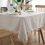 nappe table lin beige pompons blancs marbrure assiettes vases scandinave minimaliste rustic chic
