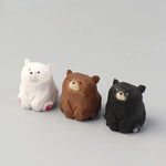 statues animaux ours blanc noir marron clair yeux noirs pattes rouges artisanal moderne