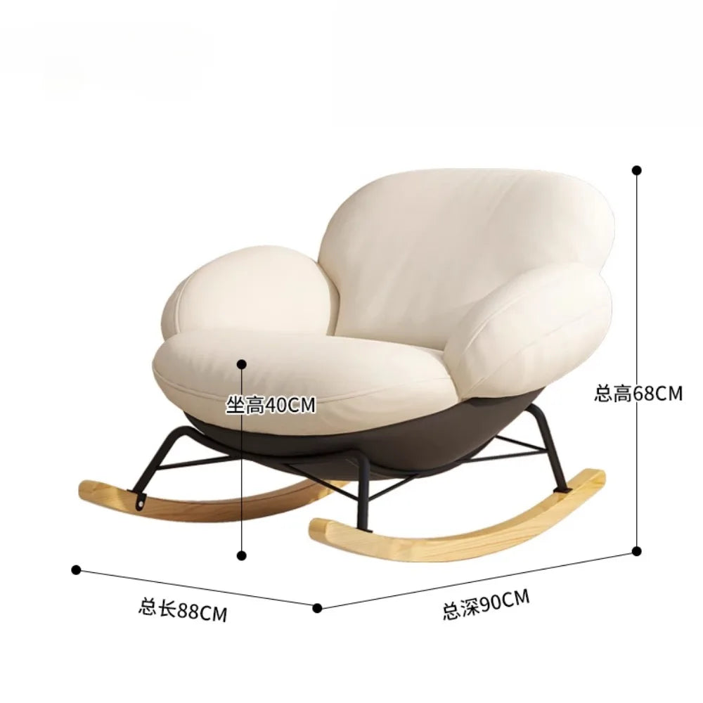 fauteuil bascule moderne beige noir orange roulettes coussin repos minimaliste salon
