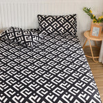 ensemble literie moderne noir blanc motif géométrique drap housse couette deux taies oreillers bord