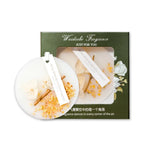 Le parfum Waidobe Fragrance "Just for You" est présenté dans une boîte verte avec des fleurs et des bâtons d'encens, suggérant une fragrance douce et naturelle.