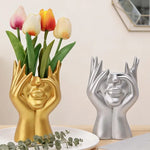support pinceaux maquillage or argent noir visage stylisé moderne sculpturaliaux pinceaux