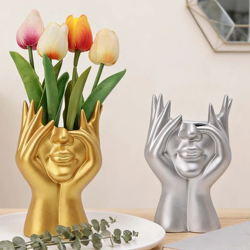 support pinceaux maquillage or argent noir visage stylisé moderne sculpturaliaux pinceaux