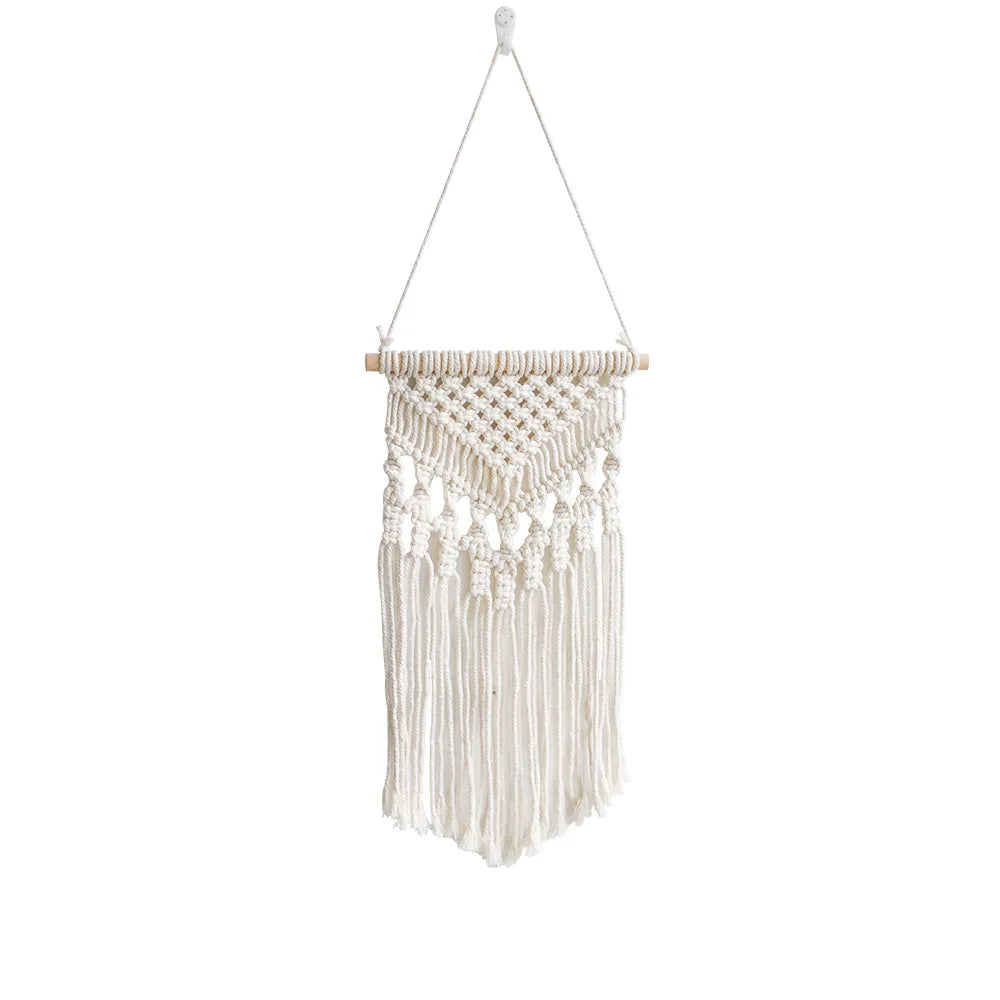 tapisserie macramé bohème beige clair motifs géométriques franges opaques décorative art murale