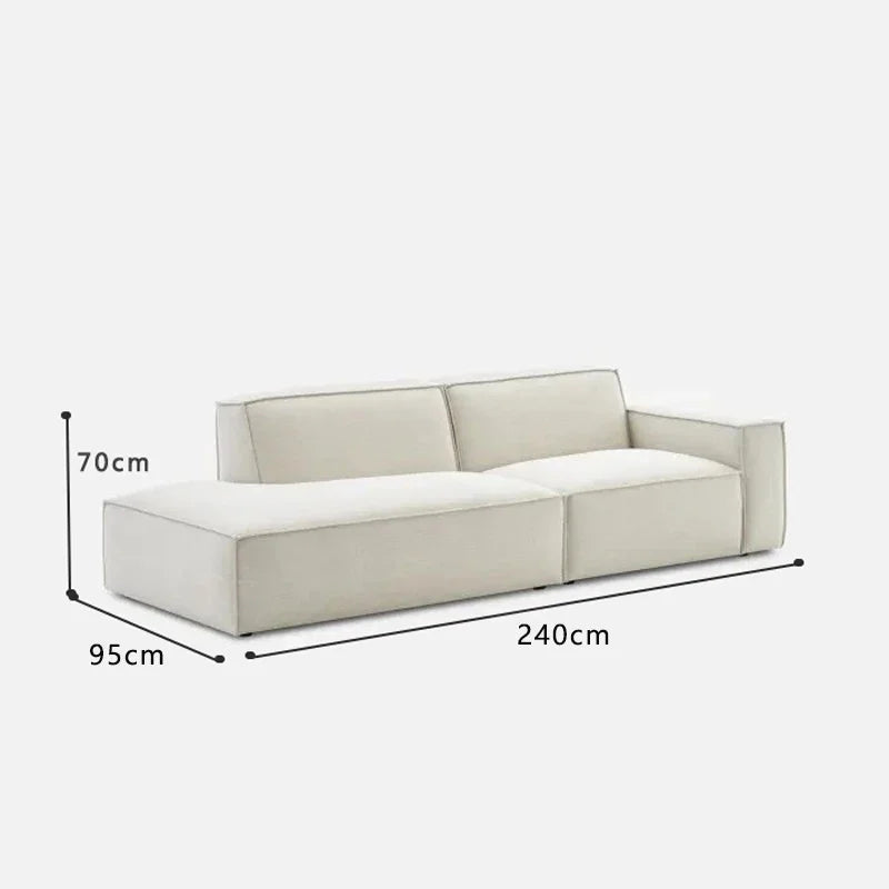 canapé d'angle moderne beige clair uni confortable salon minimaliste inclusion coussins tapis