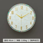 horloge murale moderne nacrée motifs veinés blanc doré irisation verte rose bleue