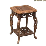 table basse bois rose classique gravures artisanal marron clair pot plante figurine cadre photo