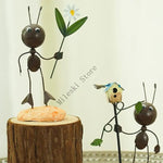 figurine métallique jardin feuilles fleurs décor extérieur moderne artisanal noir bleu vert orange blanc