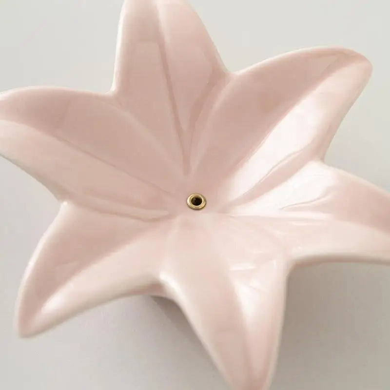 support encens fleur rose pâle doré moderne texture lisse brillante argenté