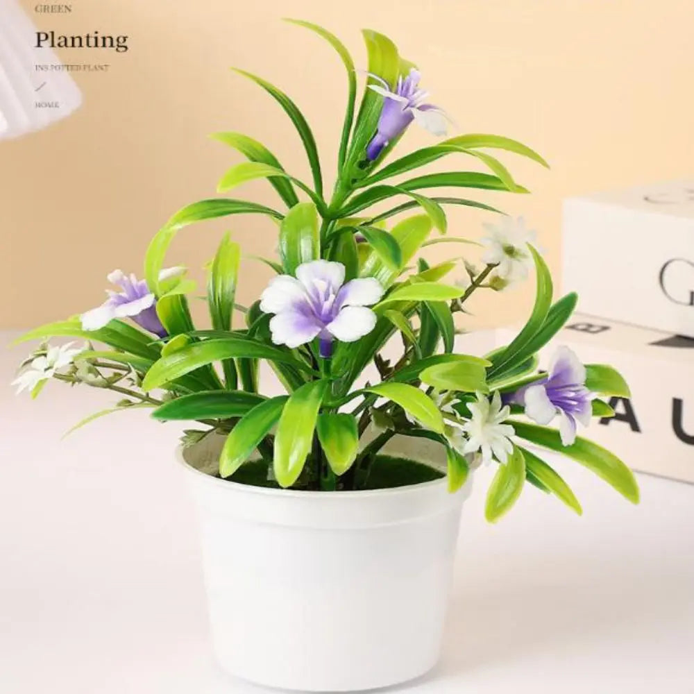 plantes artificielles modernes feuilles vertes fleurs jaunes oranges violettes pot blanc