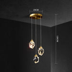 lampe suspendue or transparent cristal facettes géométriques moderne élégante tringles câbles