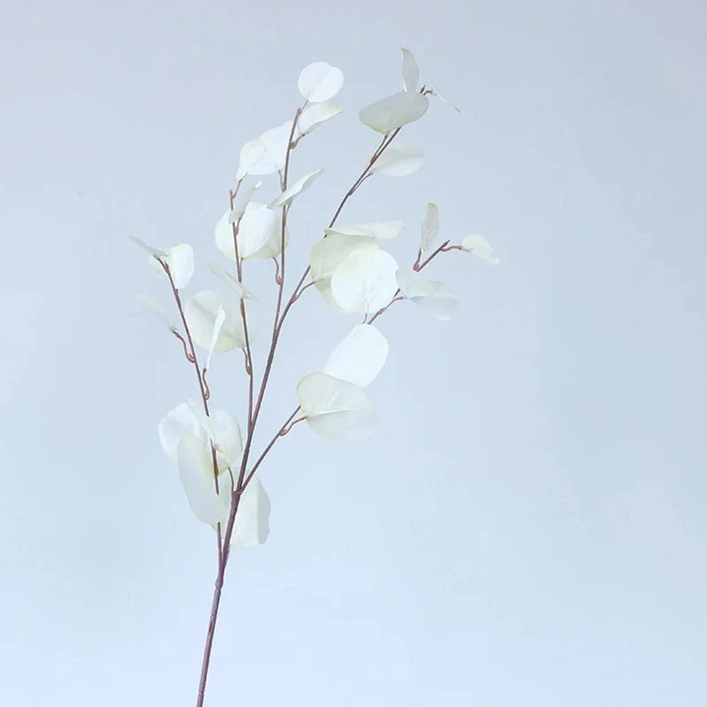 bouquet artificiel feuilles ovales moderne vase transparent support doré couleurs vives exposition intérieure
