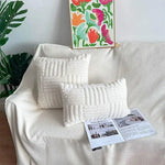 coussins décoratifs modernes texture duveteuse motifs rectangles couleurs vert menthe beige rose blanc gris