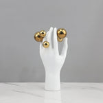 sculpture main humaine sphere argentee deco moderne blanc lisse brillante