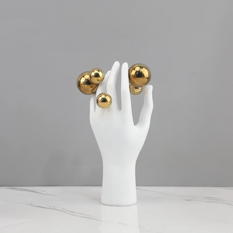 sculpture main humaine sphere argentee deco moderne blanc lisse brillante